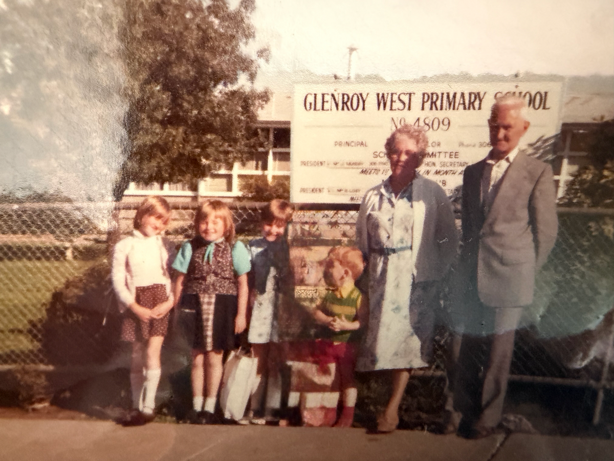 Erica, second from the left, with Audrey beside her and Audrey’s grandparents. Two little girls smiling for the camera, before the gun, the violence, and the strange business of dancing and returning to school as though childhood could simply carry on.