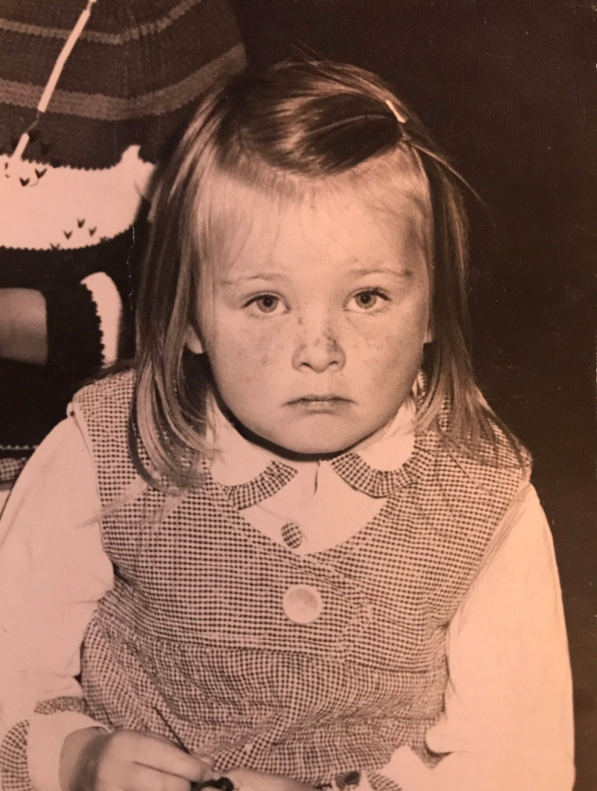Erica in a quieter moment, carrying far more sadness than a child should know how to hold. Long before the language of boundaries or burnout, she was already learning to cope with what was happening around her, even when nobody else could see it.