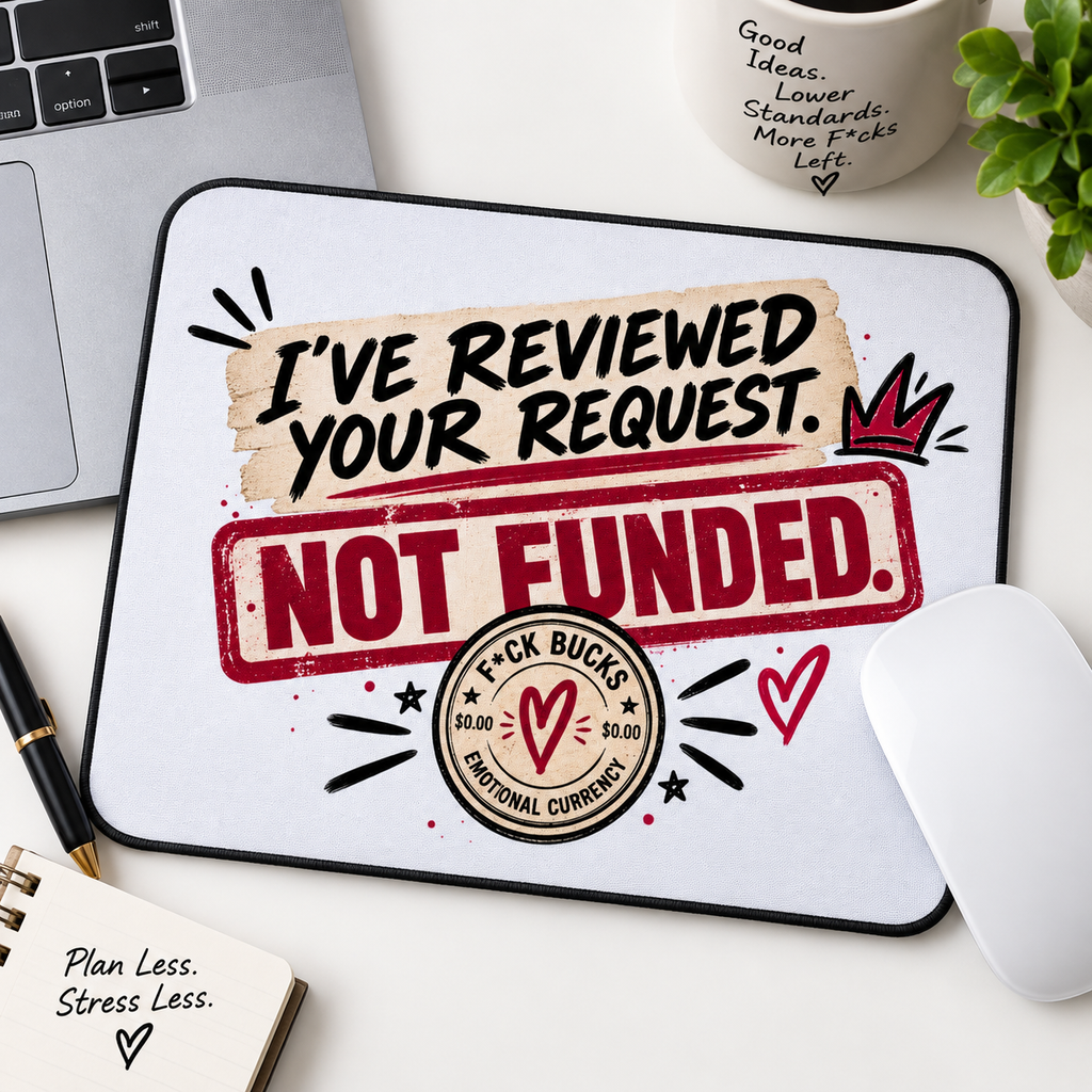 The F*ck Budget 'I've reviewed your request. Not funded' mouse pad on a desk.